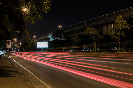 Speed Traffic at Night time - light trails on road, long exposure abstract urban backgroundの写真素材
