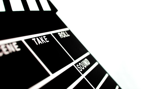 Abstract Clapperboard shallow depth isolated on white backgroundの写真素材