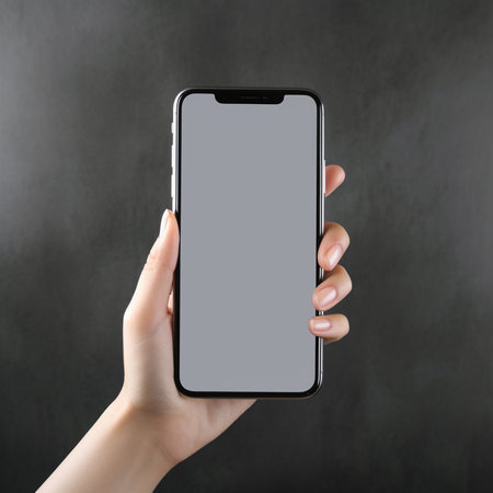 Female hand holding black smartphone with blank screen. Mock up, 3D Renderingの素材