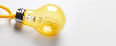 Yellow light bulb on a white background. The concept of creativity and innovation.の素材