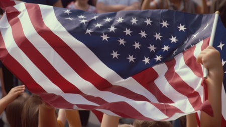 Group of people holding american flags. Selective focus on the flagの素材