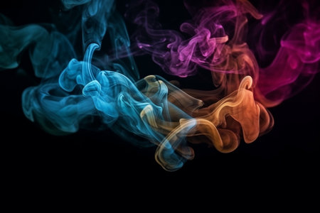 Colorful smoke isolated on black background. Abstract background for design.の素材