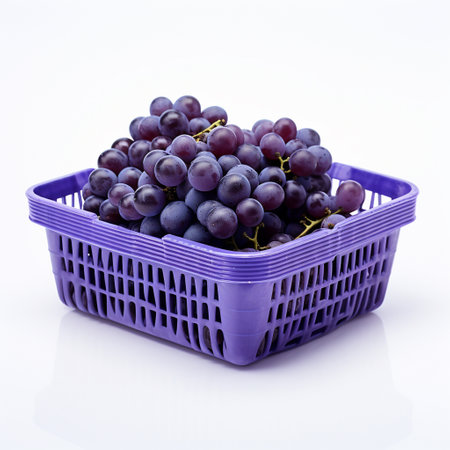 Grapes in a purple basket on a white background, isolatedの素材