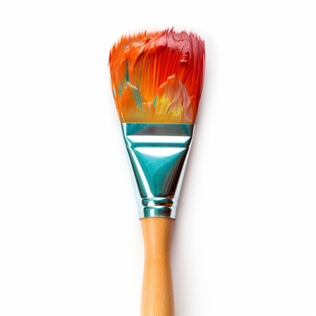 Paint brush with orange and blue paint isolated on white background.の素材