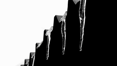 Icicles Hanging from the roofの写真素材