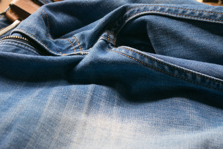 closed up blue jeans with leather belt, selective focusの写真素材