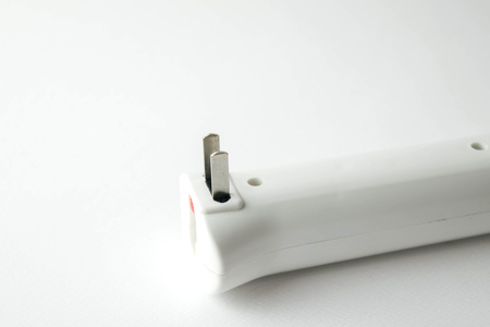 male plug on handle of electric applianceの写真素材