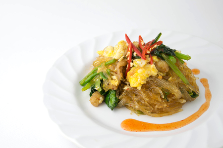 stir fried vermicelli with poultry and egg on white backgroundの写真素材