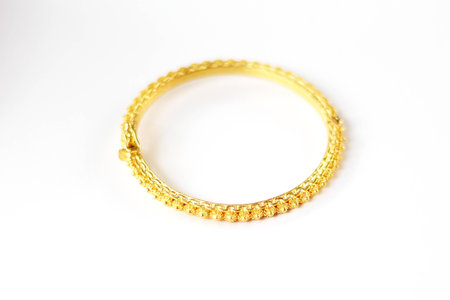 Gold bracelet isolated on white background.の写真素材
