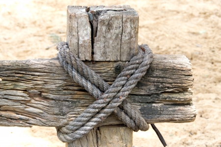 two layers of rope tied around a woodenの写真素材