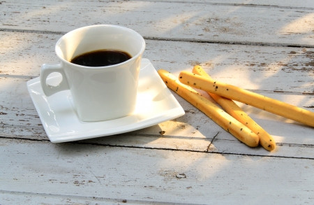 cup of coffee over grunge wooden backgroundの写真素材