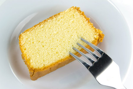 Butter cake with a fork