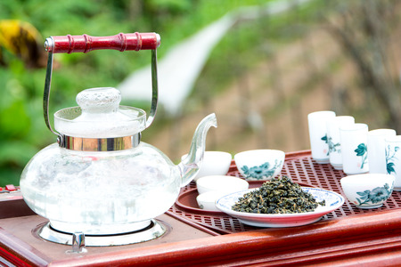 Tea set on a wooden plateの写真素材