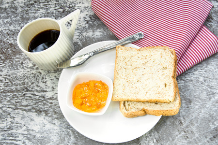 orange marmalade and bread for breakfastの写真素材