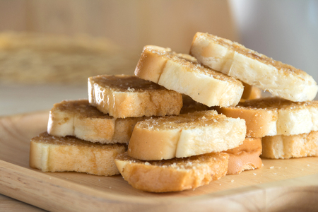 Bread Butter Crisp on wood plateの写真素材
