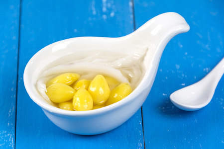 Ginkgo Nuts in Syrup with young Coconut in white bowlの写真素材