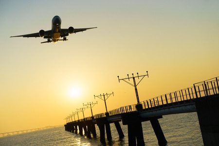Airplane landing at Hong Kong International Airportの写真素材