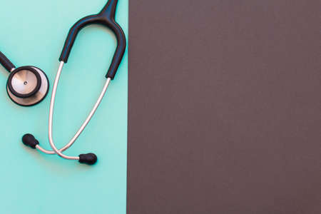 Black stethoscope for doctor diagnostic  disease, medical tool for health on blue and black background with copy space. for text message or media and content.の写真素材