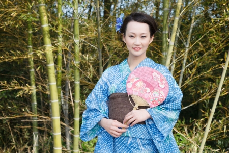 Asian kimono woman with bamboo groveの写真素材