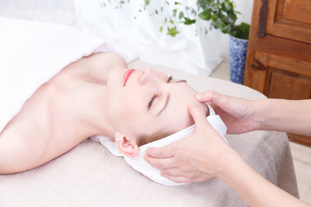 Young woman to head massageの写真素材