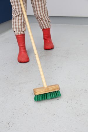 Woman cleaning the floorの写真素材