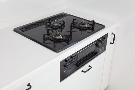 Cooktop with three burners in a modern kitchen