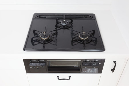 Cooktop with three burners in a modern kitchen