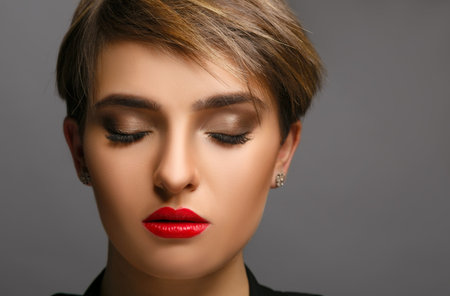 Glamour portrait of a beautiful  lady with short hair and proffessional make up.の写真素材
