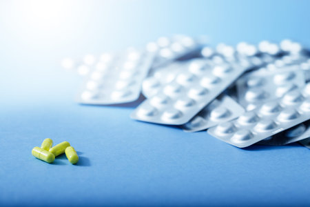 Yellow capsules and different blister of pills. Different pills. Medical and different concept of...