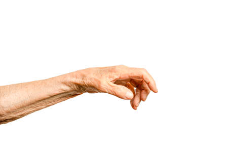 Old lady arm. Hand of elderly women on a white backgroundの写真素材