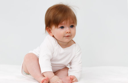 Portrait of cute happy six month baby girl. Childhood and baby care concept.