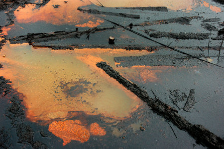 Spills of crude oil on the soil surface - environment pollution.の写真素材