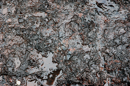 Spills of crude oil on the soil surface - environment pollution.の写真素材