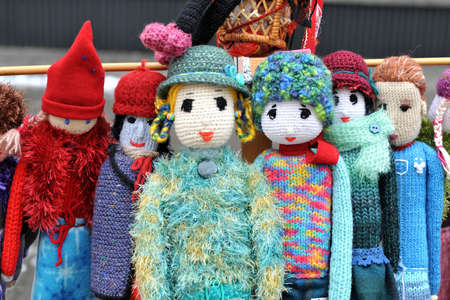 Colorful handmade knitted dolls. close up. Showcase at the fairの写真素材