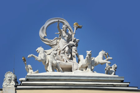 Statue of greek goddess Melpomene patroness of art in a chariot drawn by four panthers over the facade of the Opera House in Odessa, Ukraineのeditorial素材
