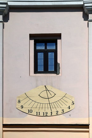 Sundial on the wall of the Roman Catholic church, Chernivtsi, Ukraine.