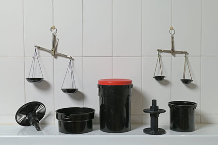 Film developing tanks and scales for weighing chemicals in a photo lab