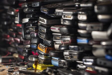 Many old mobile phones are technologically outdated, and some spare partsの写真素材