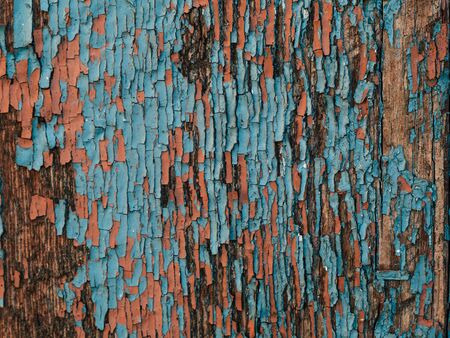 Color-Peel wood texture. Old wooden painted light blue rustic fence, paint peeling backgroundの写真素材