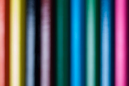 Simple colorful background, pencils out of focusの写真素材