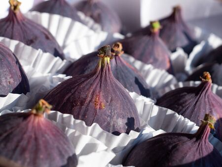Fresh ripe figs as background, top view. Tropical fruitの写真素材