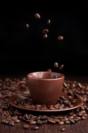Coffee beans flow in a cupの写真素材