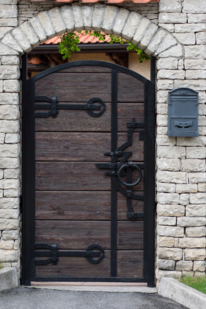 Wooden door with metal decoration.の写真素材