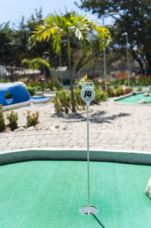 Hole 14 on a tropical outdoor golf courseの写真素材