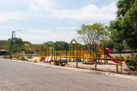 Streetscape of an empty playground roped off with police tape during Covid-19 closures