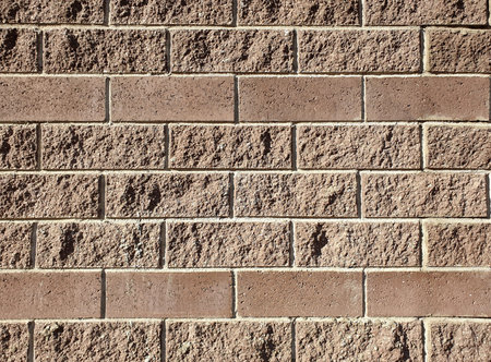 Close up of textured red bricks wall background.