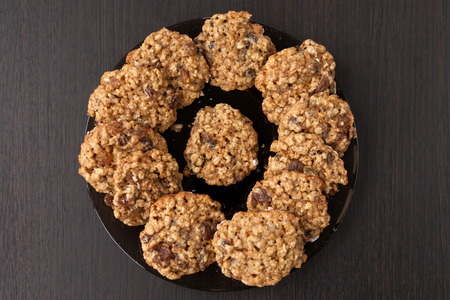 oatmeal cookies with raisins on a plate on tableの写真素材
