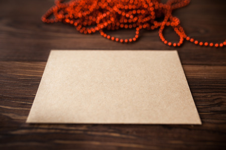 Envelope with Christmas decoration on brown wood tableの写真素材