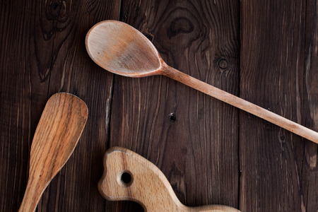 Homemade wood kitchen tools on rustic tableの写真素材