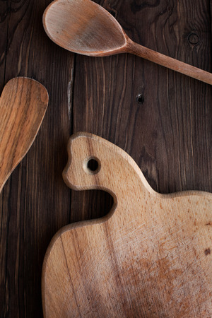 Homemade wood kitchen tools on rustic tableの写真素材